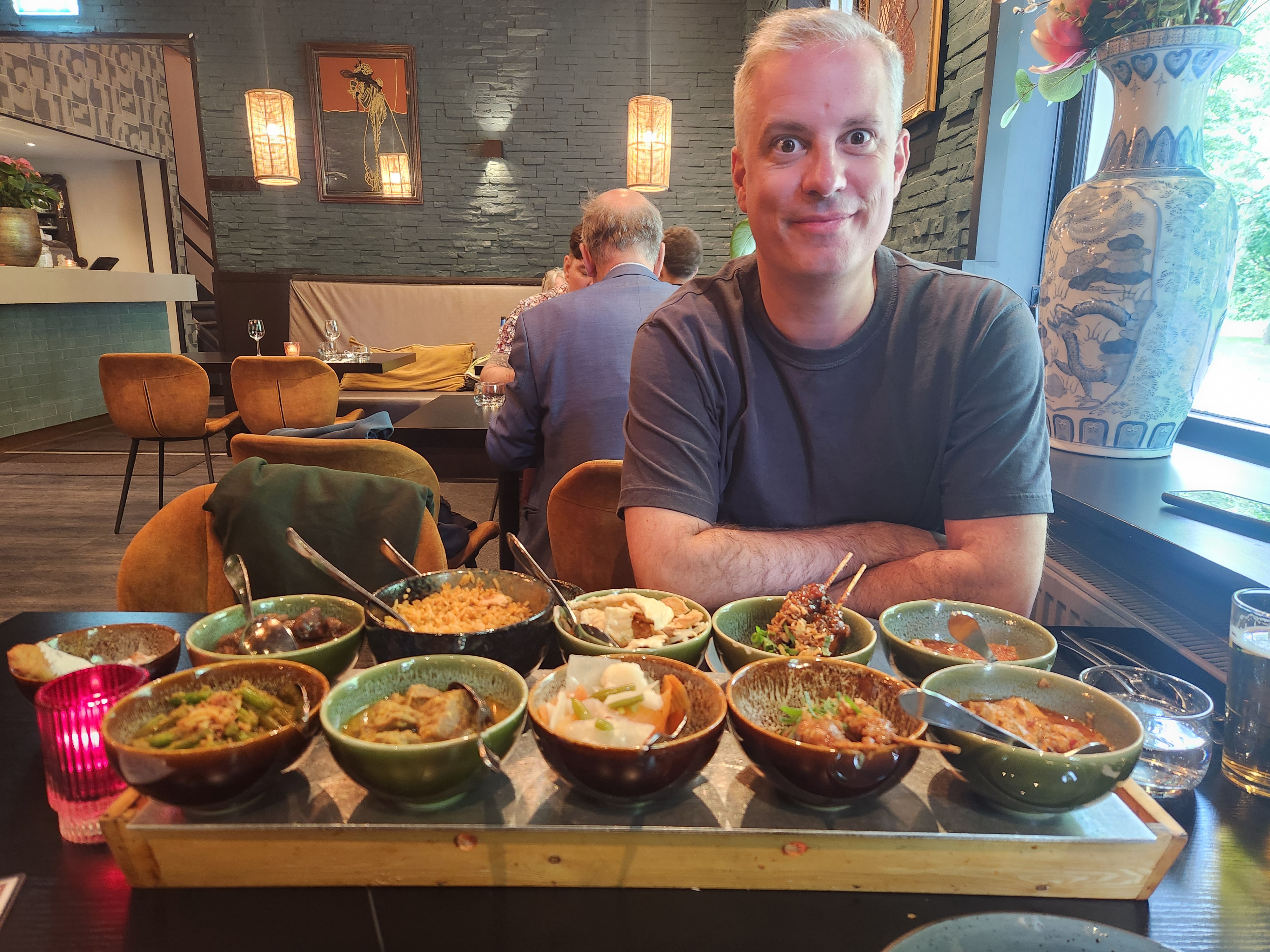 Mark looking very excited at a table full of Indonesian food