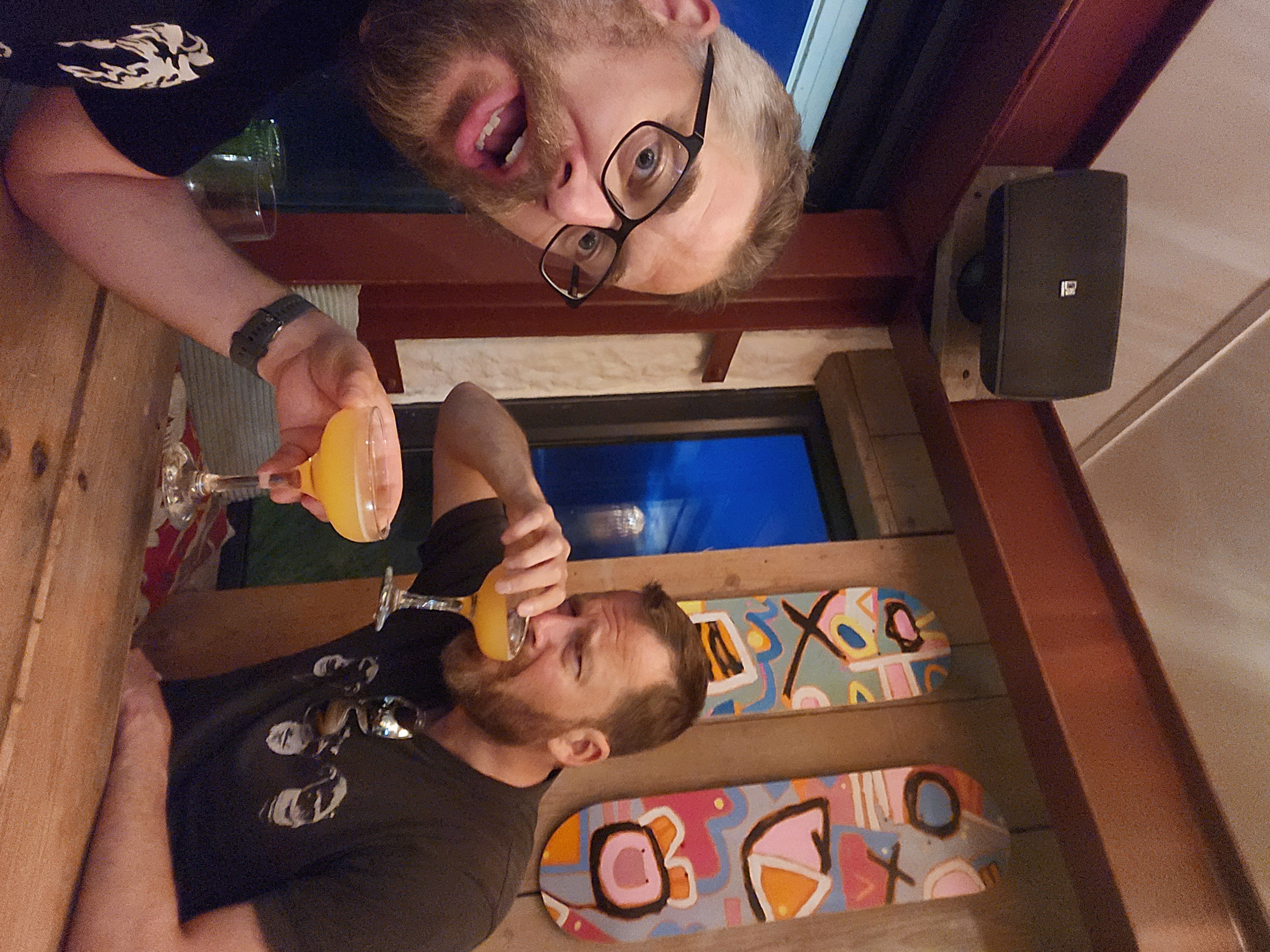 Chris and I drinking a mai tai, Chris is not impressed with it